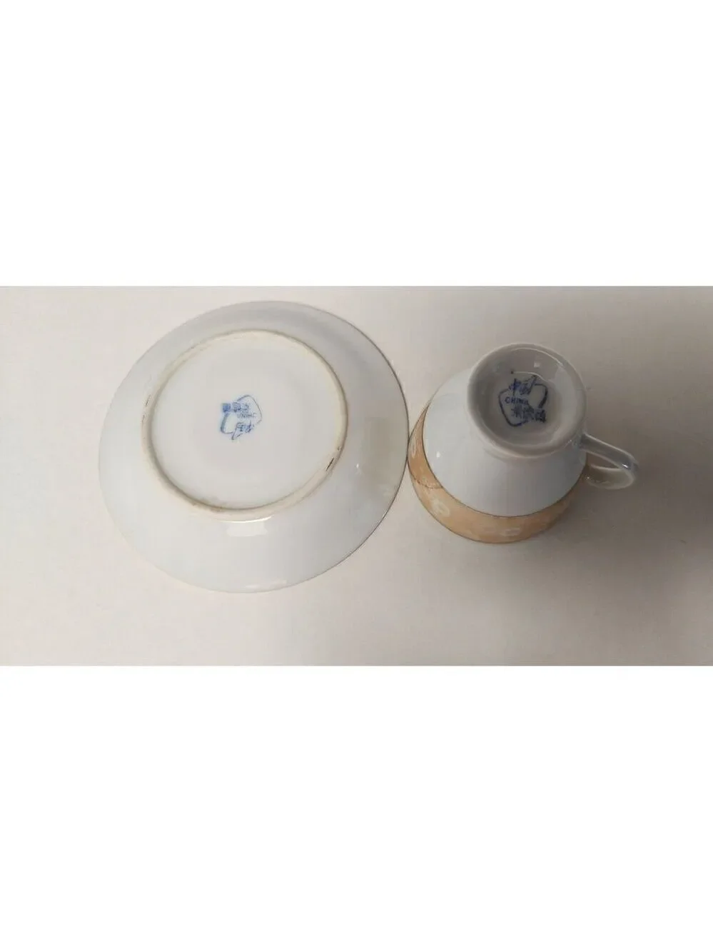 FOOTED MINITURE TEACUP AND SAUCER SET YELLOW W/ GOLD TRIM